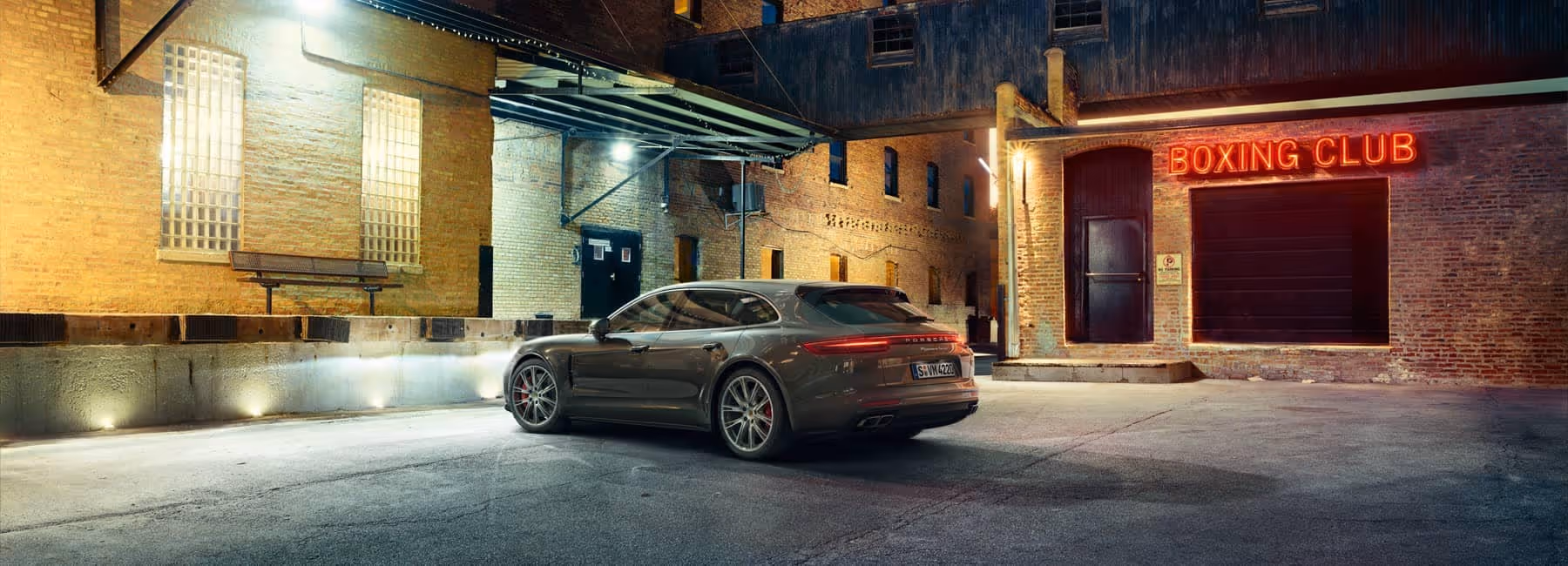 Panamera Turbo Sport Turismo in front of a boxing club.